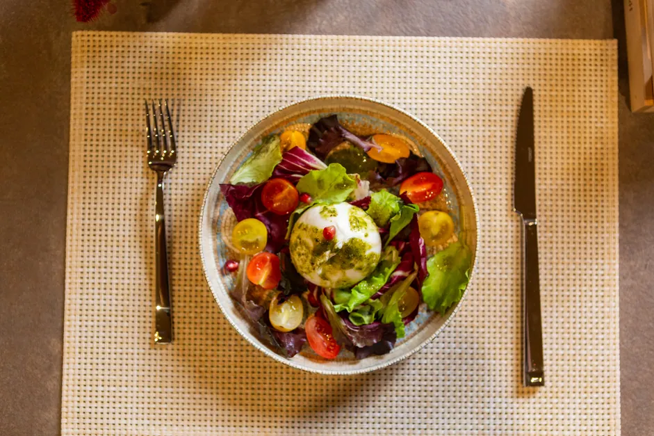 Burrata with pesto and heirloom tomatoes